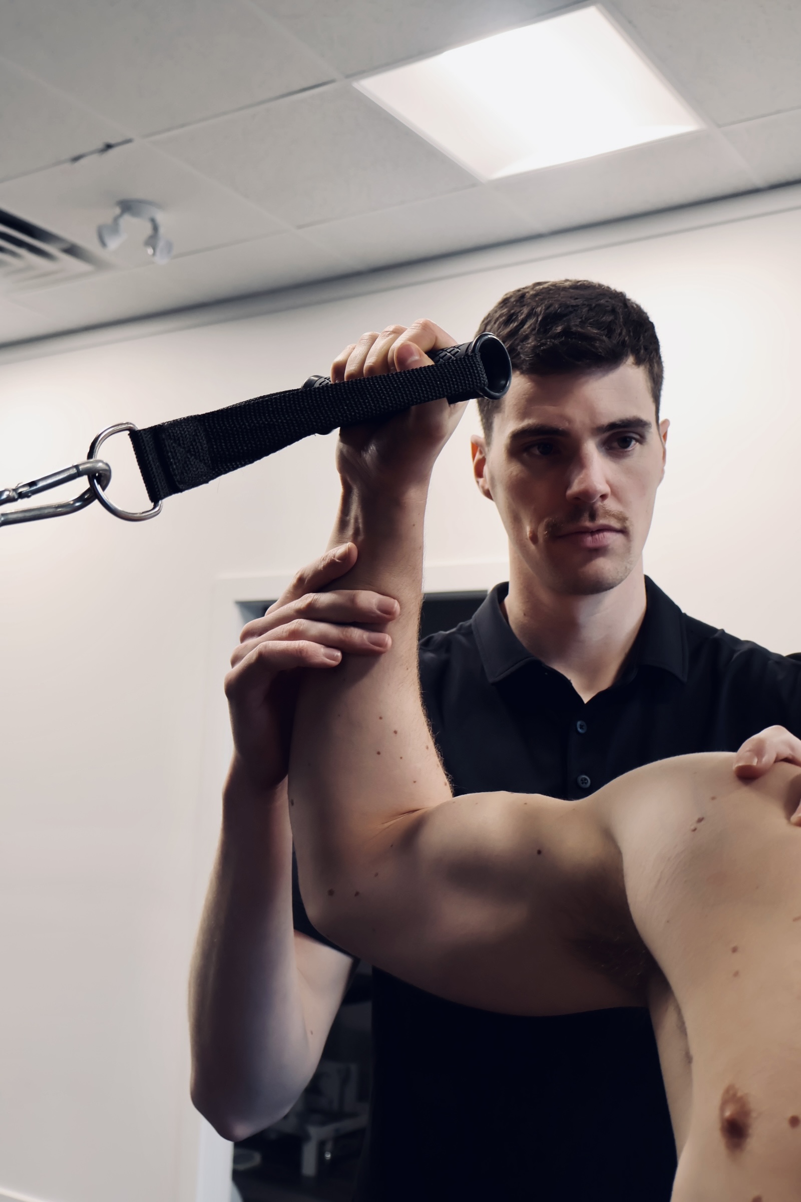 Physiotherapist assessing knee injury in Kitsilano clinic